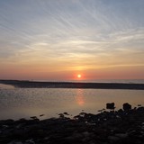 Zonsondergang op het strand in Nieuwvliet op vrijdagavond 31 juli 2015.