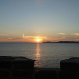 Zonsondergang bezien vanaf de wallen van het oude centrum in Alghero.