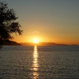 Zonsondergang. Op de achtergrond Corsica.